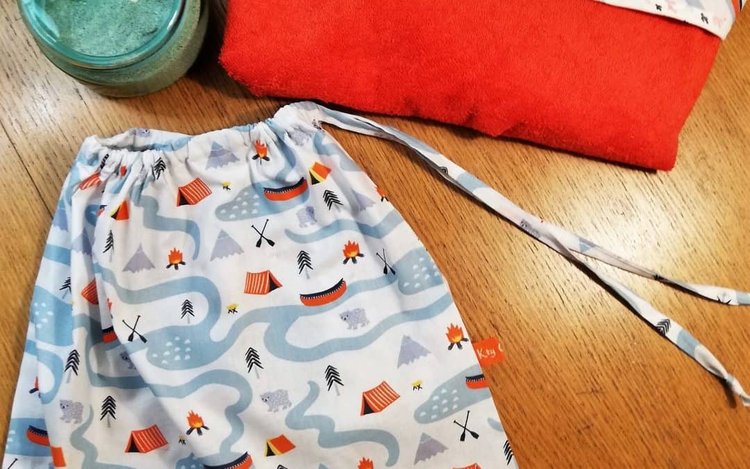 La cape de bain et sa pochette cadeau